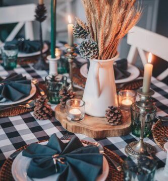 clear glass condiment shakers on brown wooden table