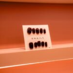 A display of nails on a shelf in a bathroom